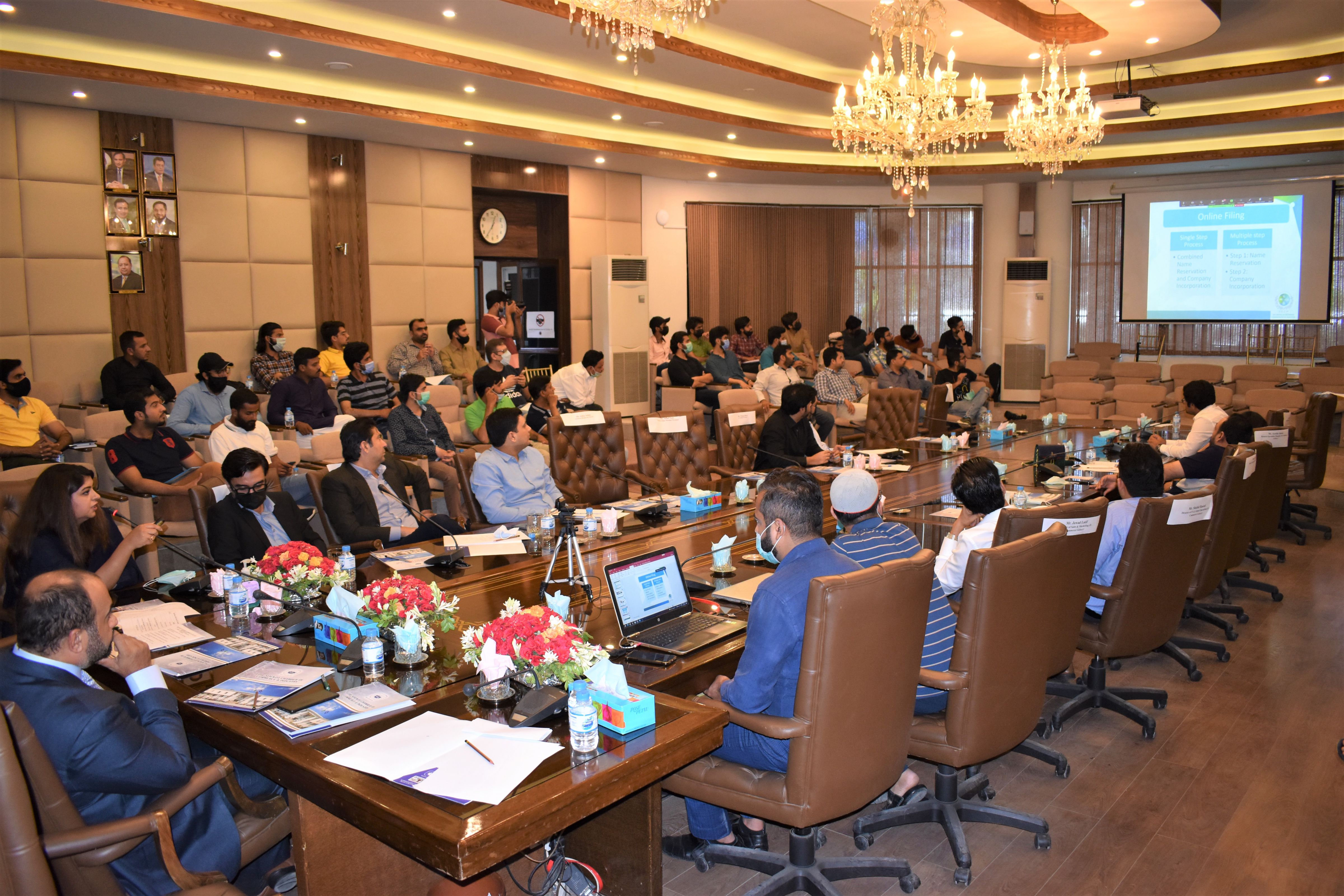 On July 13, 2021, Sialkot Chamber of Commerce & Industry in collaboration with E-Commerce Galaxy organized an intensive Seminar on “E-Commerce, Amazon, Payoneer, and usage of SEO Tools” to educate the existing as well as new exporters of Industry of Sialkot regarding the dynamics of selling their products on E-Commerce platforms mainly Amazon, Ebay. Mr. Qaisar Iqbal Baryar appreciated the efforts of Ms. Aisha Moriani and her team for working in getting Made in Sialkot products recognized on Amazon. An (MOU) was also signed between SCCI and E-commerce Galaxy for future collaborations. Mr. Khuram Aslam, Senior Vice President, SCCI also graced the event. Ms. Azka Ameen, Assitant Registrar SECP gave an introductory presentation regarding company incorporation with SECP using online portal. Team E-commerce Galaxy gave a detailed presentation on various aspects of working on Amazon for SME.  Ms. Affaf Noor, Partnerships Manager Payoneer explained the audience about the payment gateway and integration with various ecommerce and freelancing platforms.  Ms Ayesha Moriani, Senior Joint Secretary, Ministry of Commerce, Dr Shahzad Yousaf, City of London College, Mr. Urfan Yaqub, Co Founder & Director E-Commerce Galaxy and his whole team, Mr. Kumail Nadeem, Deputy Registrar SECP. Mr. Mohsin Muzafar, Country Head Payoneer & his team and Mr. Hassan Shah, Cordinator Ministry of Commerce’s Think Tank on Amazon and representatives from Punjab Information Technology Board (PITB) briefed the audience  regarding various dynamics of E-Commerce and Issues faced by sellers during account creation and product listing were also discussed and relevant solutions were advised through Q/A session. The Seminar was broadcasted live on Facebook and Zoom apart from being arranged at the Sialkot Chamber.