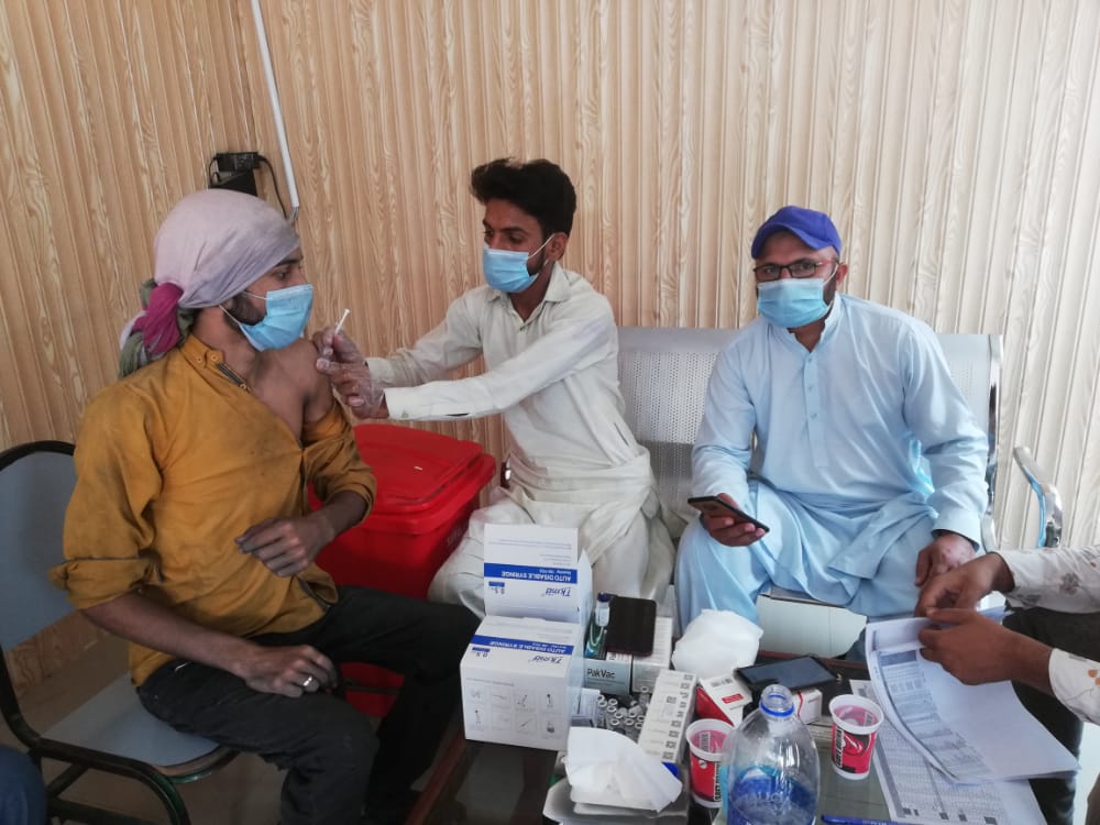 HealthCare Workers working under SCCI Covid-19 Vaccination Drive vaccinating Laborers of a local Industry adhering to COVID-19 SOPs.