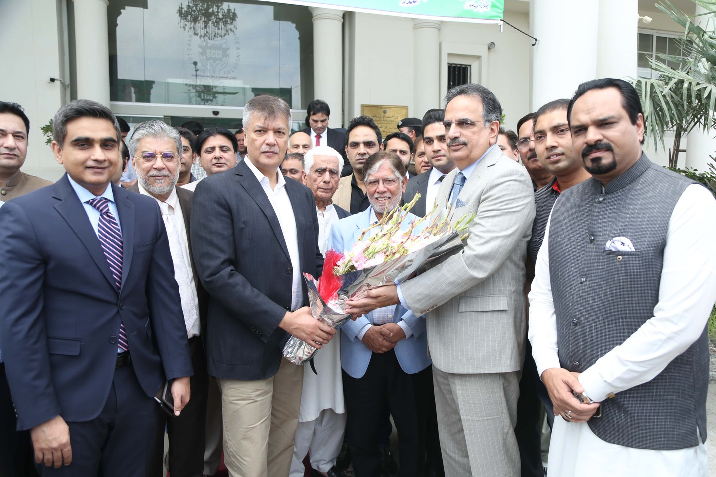 On May 30, 2023, Mr. S.M. Tanveer, Provincial Minister for Industries, Commerce, Energy, Investment & Skill Development (ISI&SD), visited the Sialkot Chamber of Commerce & Industry (SCCI). Mr. Abdul Ghafoor Malik, President of SCCI, welcomed the Minister and appreciated the formation of the Punjab Chambers of Commerce Coordination Committee to address business community issues. Submissions made to the Minister included:  Request to restore canceled plots of Exporters in EPZ Sialkot and extend the construction timeline by 2 years. Abolition of late construction charges for Sialkot exporters was also sought. Completion of pending notification for the EPZ Board of Management (BOM) was requested to initiate development work.  Importance of renovating and operationalizing the Sports Goods Materials Testing Lab in EPZ Sialkot was emphasized. PKR 900 million PC-II from PSIC was submitted for approval, and release of funds for the project was requested.  Pending Section-V of Sialkot Industrial Zone due to non-formation of BOM of Punjab Industrial Estate Development Management Company (PIEDMC). Minister urged to expedite the process for further action.  Additional property tax on properties along highways is a financial burden on Sialkot exporters. Exclusion of export industrial units from property tax, as per Section 10 of Punjab Finance Act 2019, was requested from Punjab Revenue Authority (PRA).  Sialkot industry is 100% export-oriented, with only 2% service rate from Freight Forwarders, Clearing Agents, Auditors, and Tax Consultants. These service sectors are already registered with PRA and cause no loss to the department. Exclusion of export-oriented units from withholding sales tax on services sector was requested.  Request for PKR 1000 million for completion of Sialkot-Pasrur Road, crucial for industrial units located on it.  Minister Tanveer assured that all issues would be addressed on a priority basis to facilitate the Sialkot Business Community. Notification for S.I.E. II & S.I.E III Board of Management (BOM) was also issued as per his instructions.