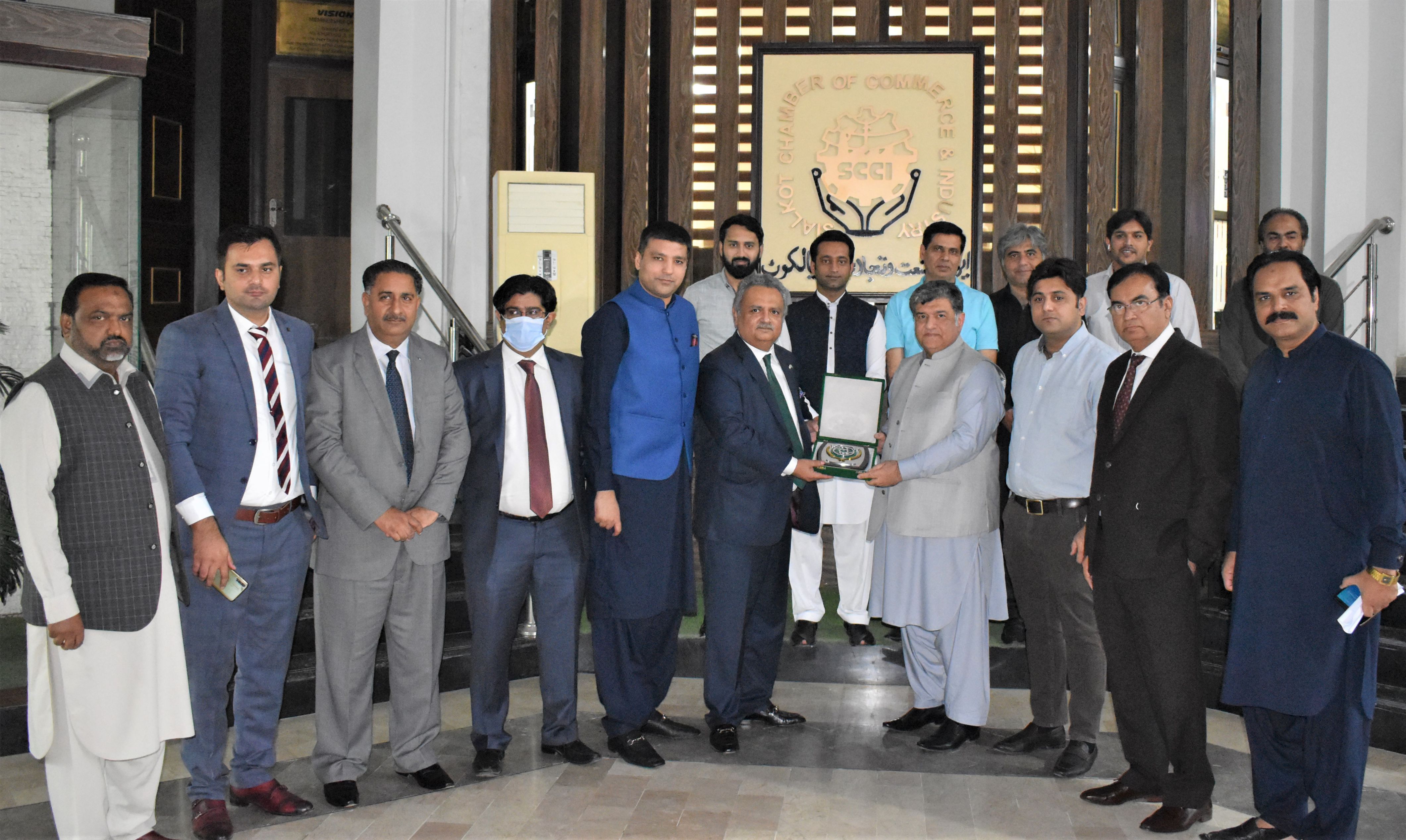 On October 14, 2021, A delegation of the National Bank of Pakistan led by Mr. Rehmat Ali Hasnie, Group Chief, Inclusive Development Group (NBP) visited The Sialkot Chamber of Commerce & Industry. The delegates had a meeting with the President, Senior Vice President, Vice President and business community of Sialkot to explore all potential areas of mutual cooperation and to build up close liaison between NBP and Business Community of Sialkot. On October 14, 2021, A delegation of the National Bank of Pakistan led by Mr. Rehmat Ali Hasnie, Group Chief, Inclusive Development Group (NBP) visited The Sialkot Chamber of Commerce & Industry. The delegates had a meeting with the President, Senior Vice President, Vice President and business community of Sialkot to explore all potential areas of mutual cooperation and to build up close liaison between NBP and Business Community of Sialkot.